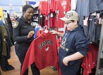 Law Enforcement Buddies Up With Kids To Pick Out Christmas Gifts News Gwinnettdailypost Com