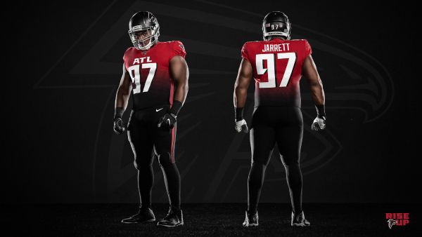 Atlanta Falcons home uniform with red jersey and white pants. The updated  helmet logo is more dynamic…