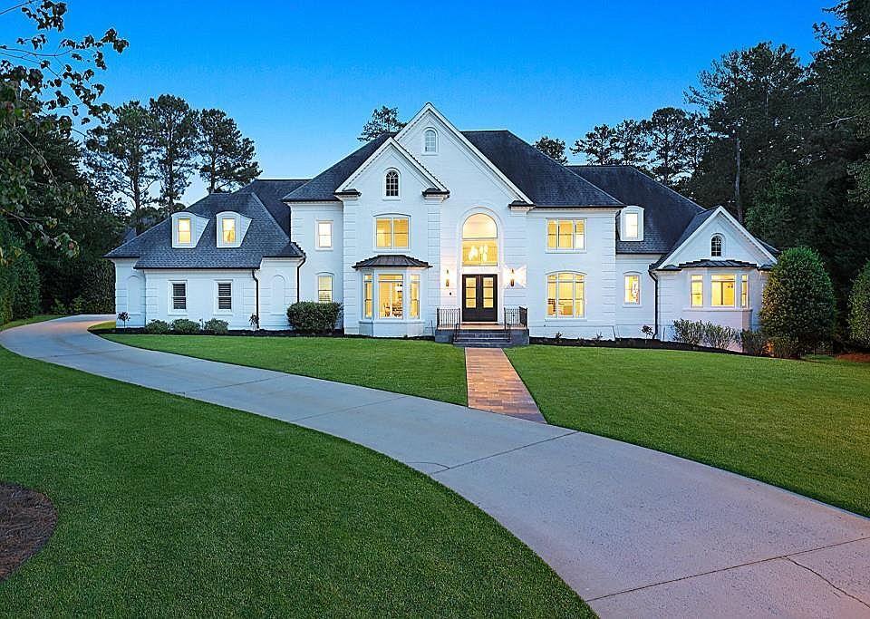 ON THE MARKET Slide into luxury — and the pool — with this 2.3 million Johns Creek home