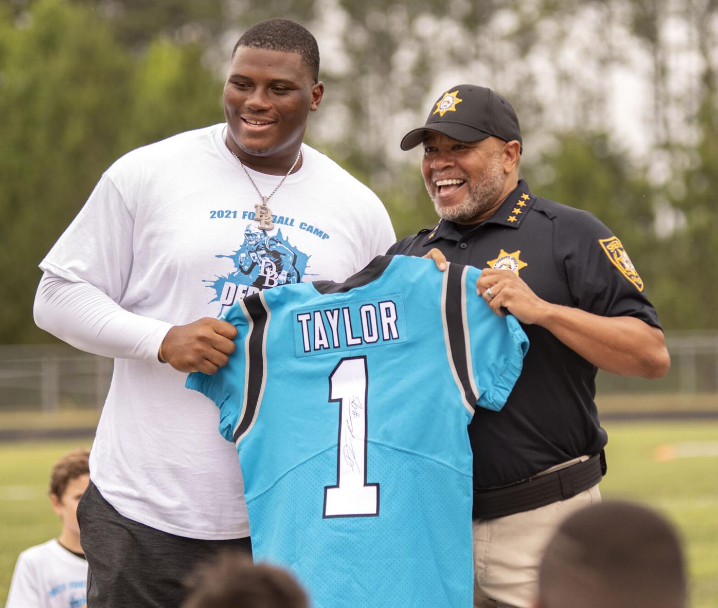 VIDEO: Lanier grad, Carolina Panthers star Derrick Brown hosts football  camp at alma mater, Sports