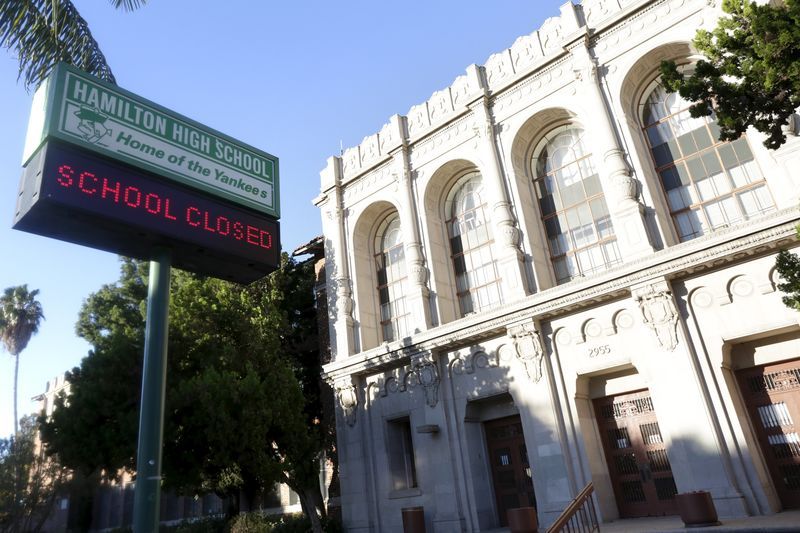 A sign at Hamilton High School is pictured reading