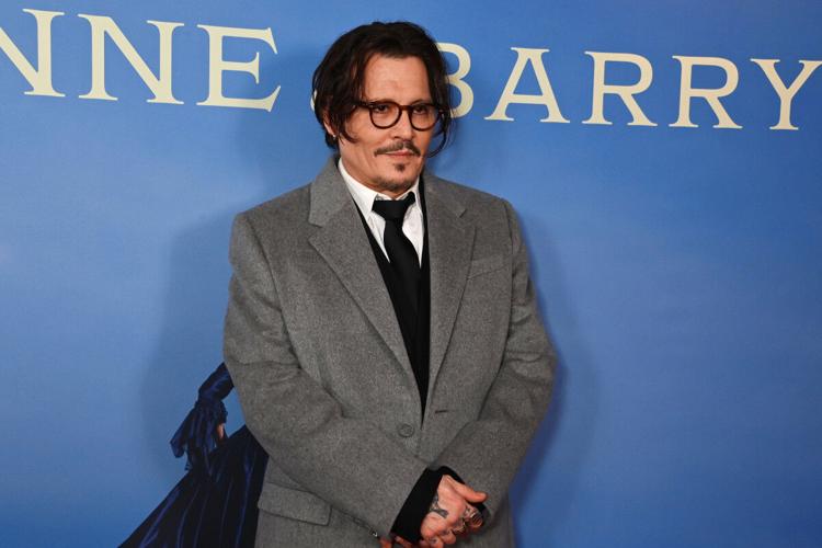 Johnny Depp Embraces His Co-Star in Rare Red Carpet Appearance ...