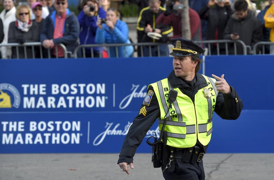 Actor Mark Wahlberg In The Role Of A Boston Police Officer Prepares To Film A Scene For The Movie Patriots Day Near The Finish Line Before The Start Of The 120th Running