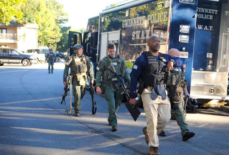 SWAT removes robbery suspect from apartment after he confesses to crime ...