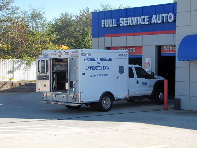 Foul play suspected after body found behind Lawrenceville oil change