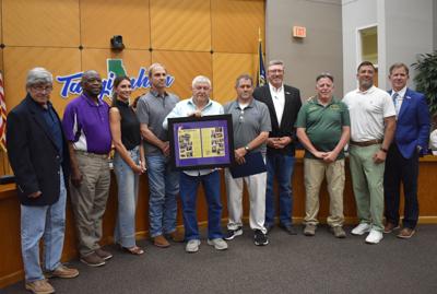 Parish honors family of Coach Bags