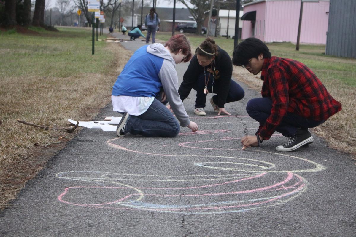 Art teacher helps the students