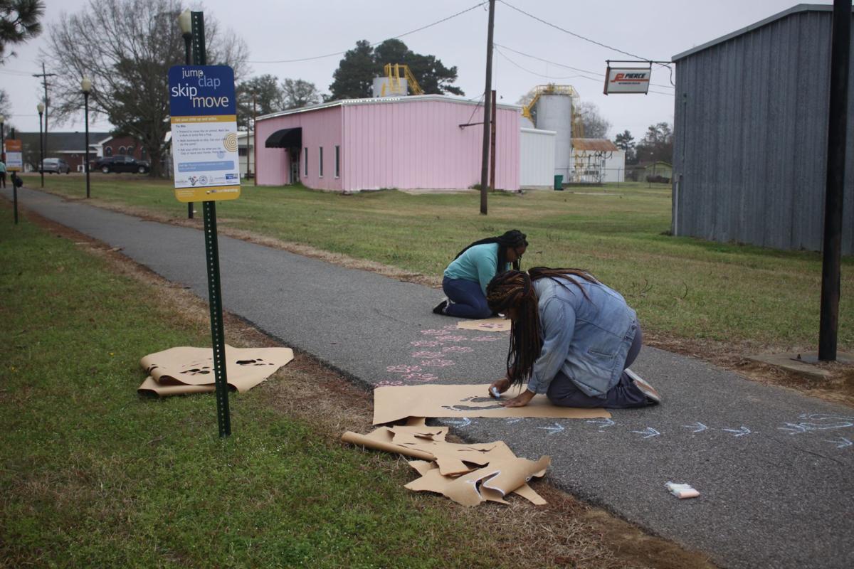 Art students add color to the pavement