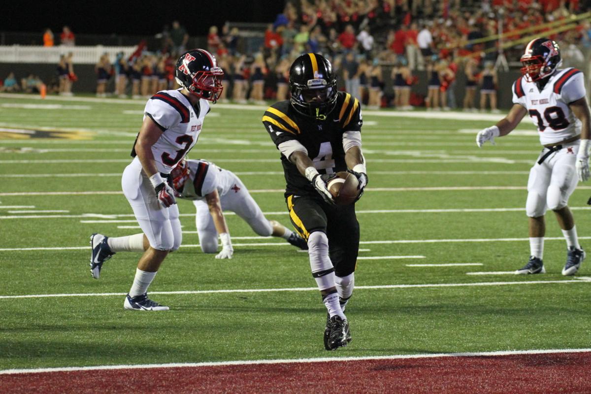Neville's Kavontae Turpin (#4) scores a touchdown
