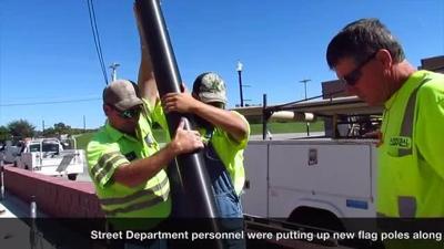 New flag poles being installed on Avenue of Flags in Hannibal | Article