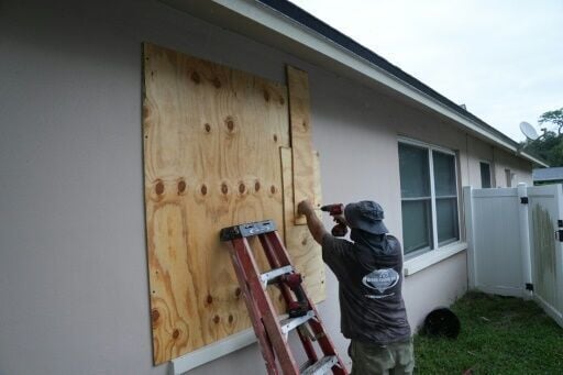 A resident boards up his windows in Palm Harbor, Florida, ahead of Hurricane Milton's expected mid-week landfall