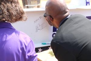 School system celebrates topping out of new STEM school