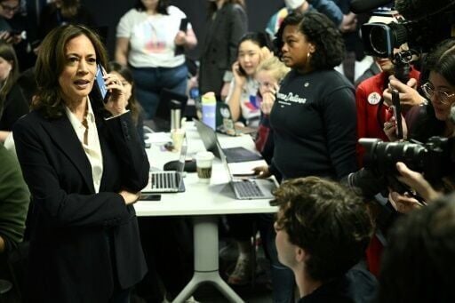 US Vice President and Democratic presidential candidate Kamala Harris takes part in a phone bank at the Democratic National Committee headquarters in Washington