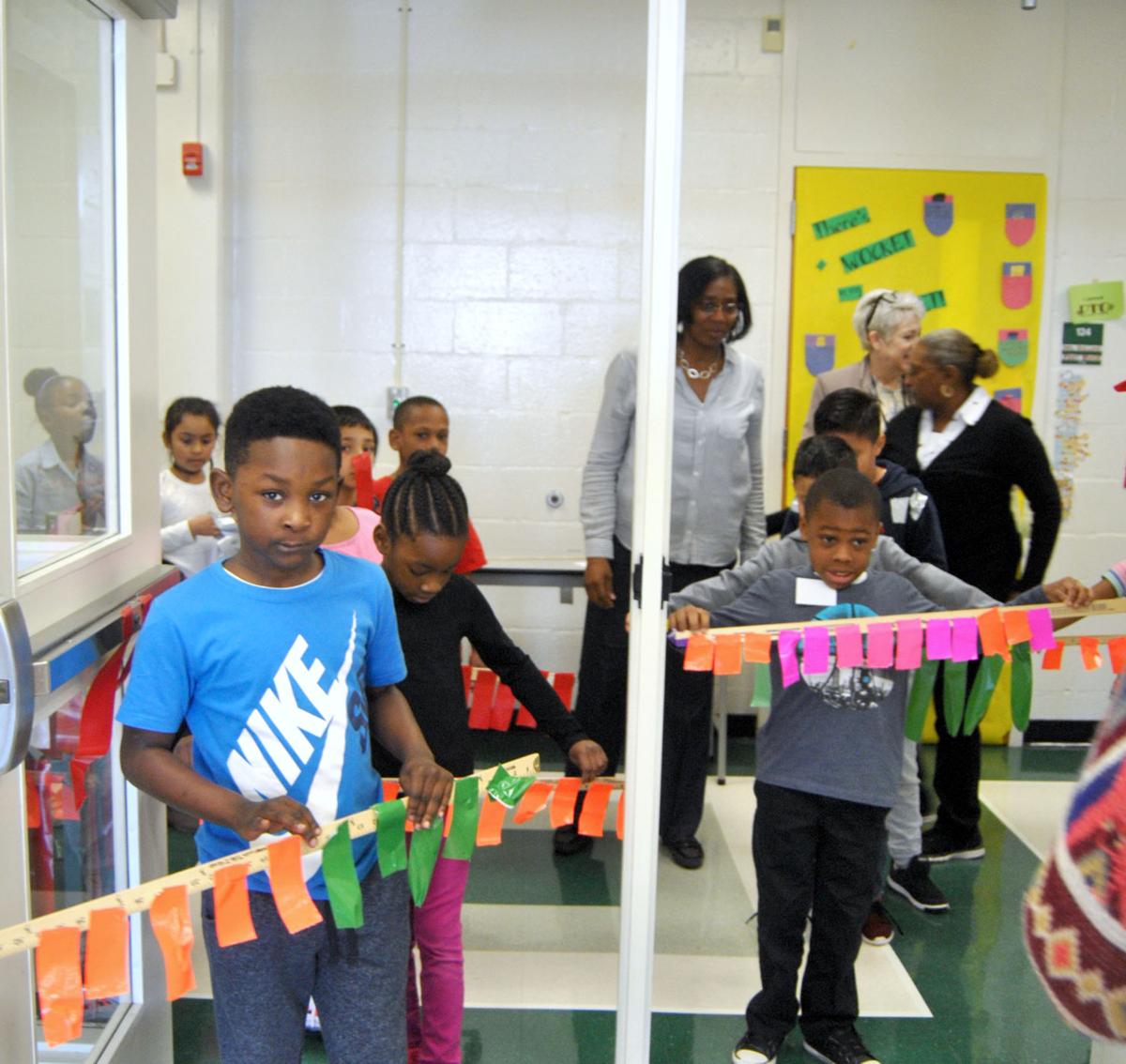 Stockbridge Elementary students tape principals to school wall