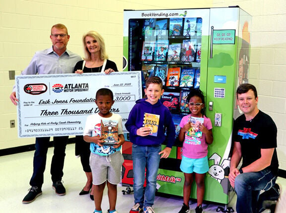 NASCAR driver Erik Jones delivers book vending machine to Rocky Creek Elementary