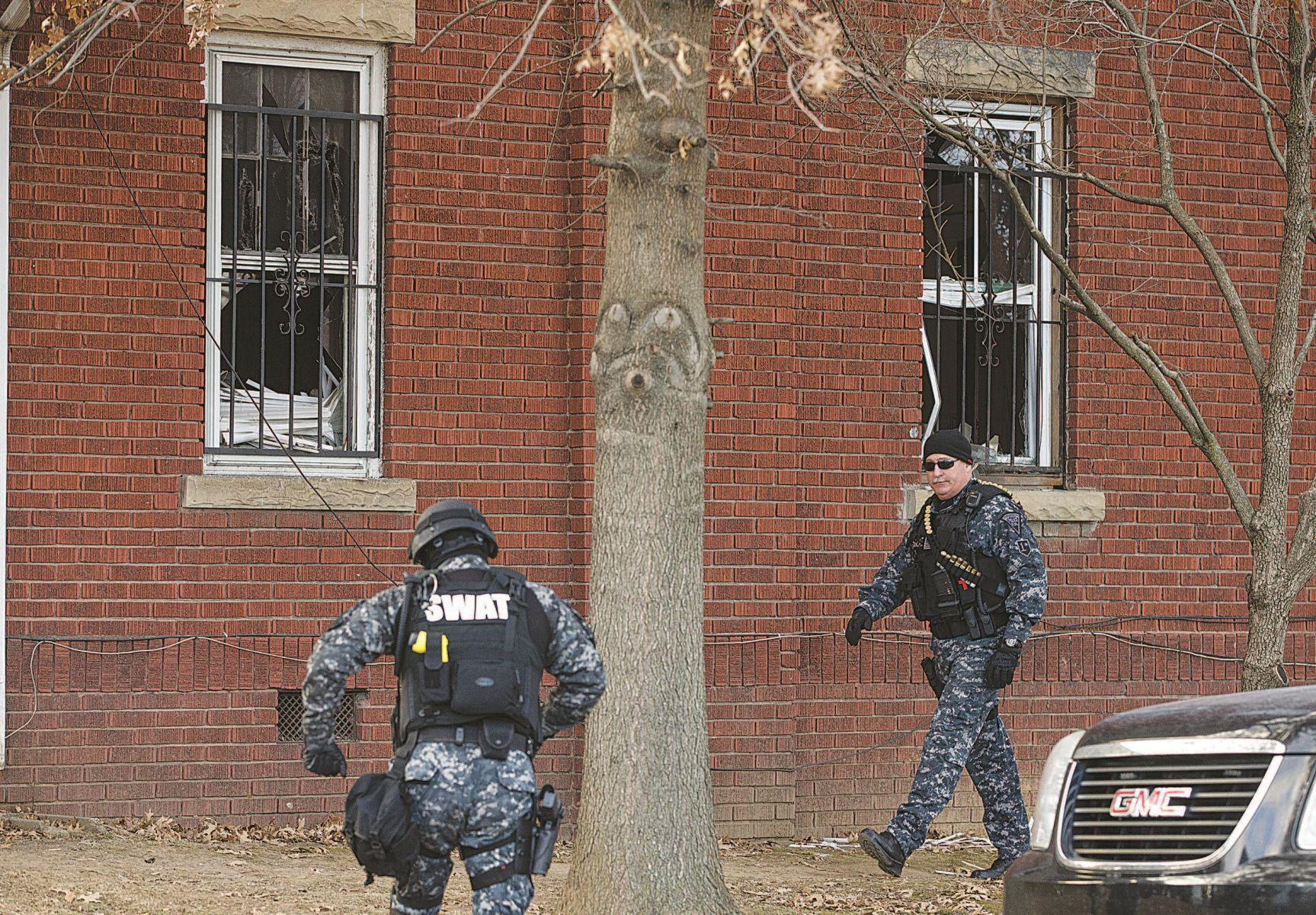Huntington police arrest 8 in raid on fortified house herald