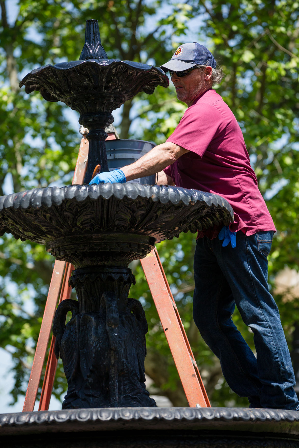 Painting Pullman Workers touch up fountain at Pullman Square News