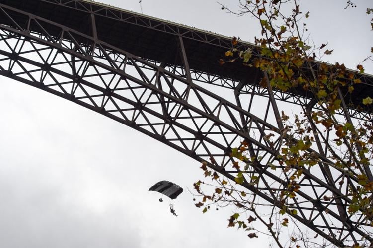 BASE jumpers leap from New River Gorge Bridge on Bridge Day | News ...