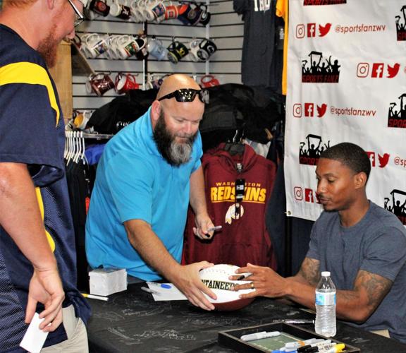 WVU football stars sign autographs at Sports Fanz Putnam News