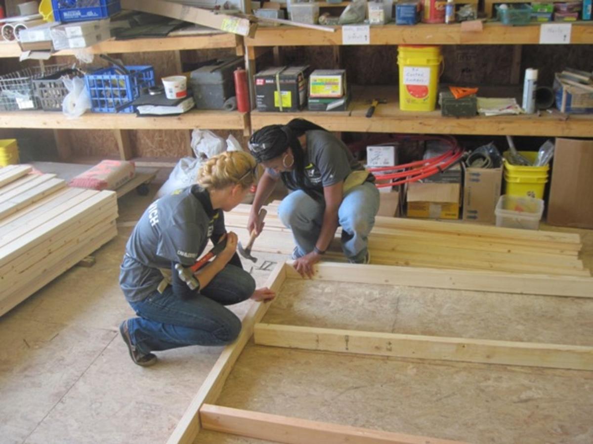 Gallery EY of Charleston volunteers help at Habitat News herald