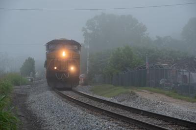 Fog sets a moody scene as CSX freight train rolls through town