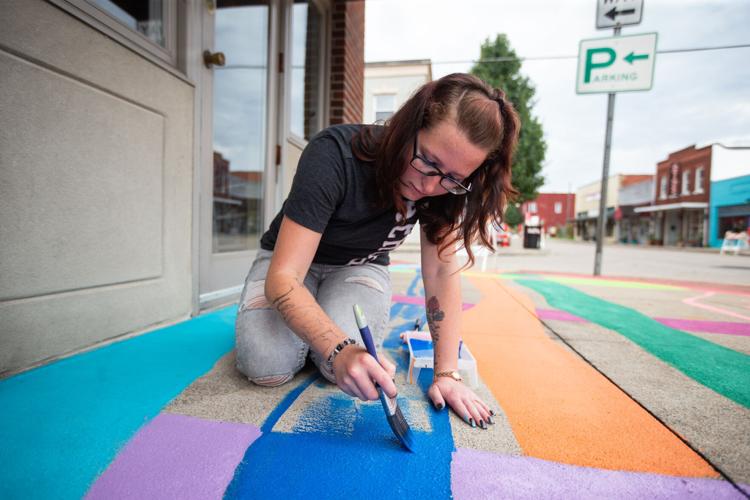Group works on final asphalt art project | News | herald-dispatch.com