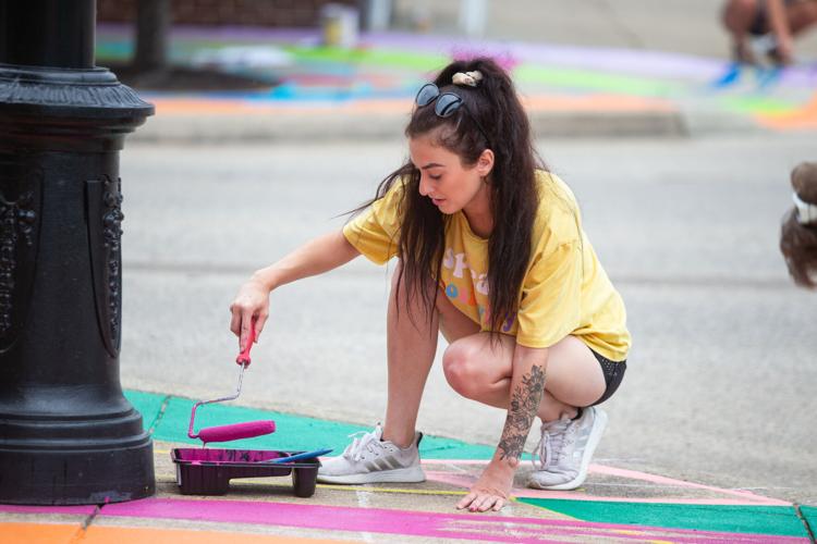Group works on final asphalt art project | News | herald-dispatch.com