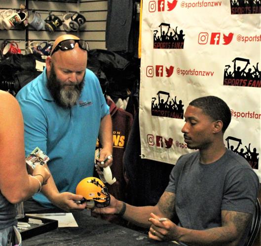 WVU football stars sign autographs at Sports Fanz Putnam News