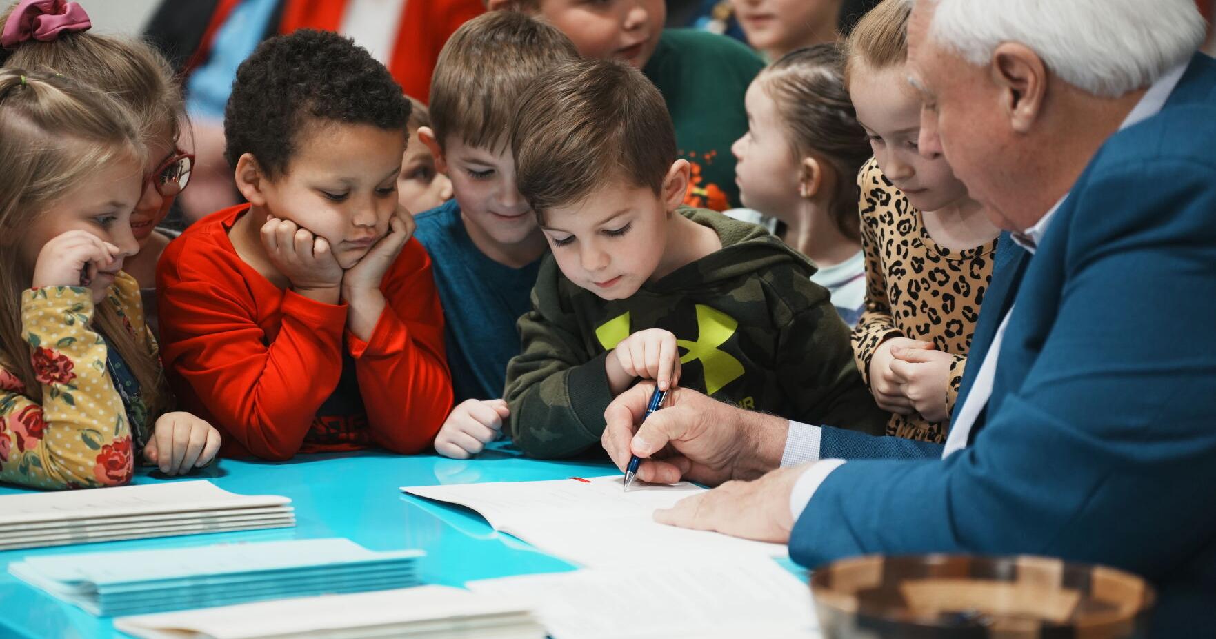 Justice signs four education bills into law