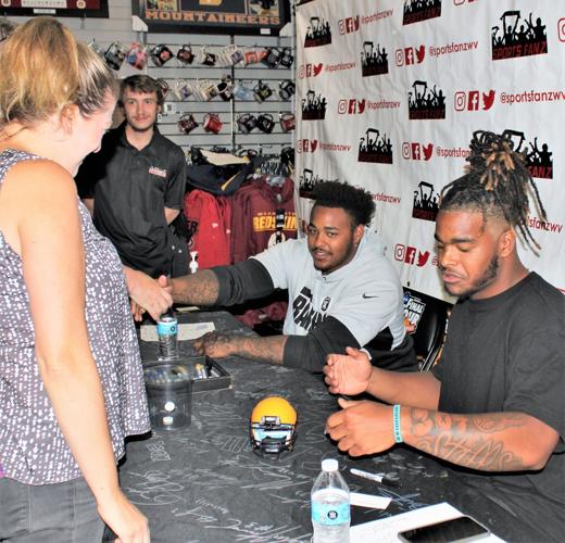 WVU football stars sign autographs at Sports Fanz Putnam News