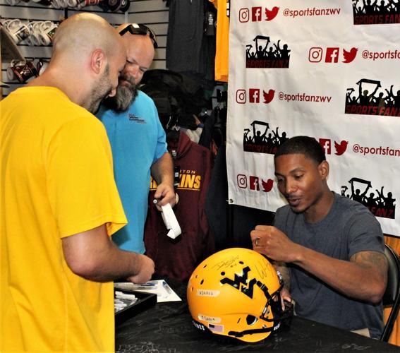 WVU football stars sign autographs at Sports Fanz Putnam News