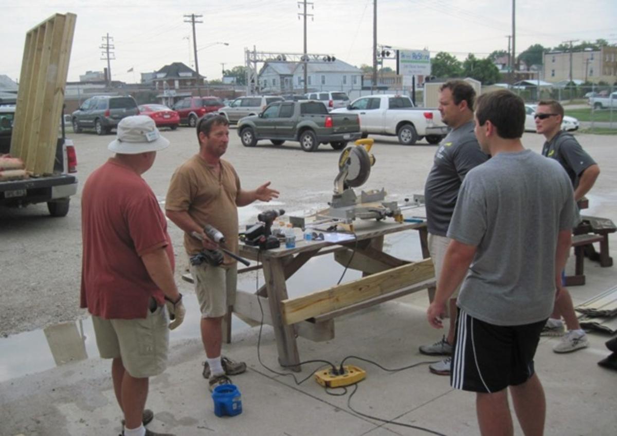 Gallery EY of Charleston volunteers help at Habitat News herald