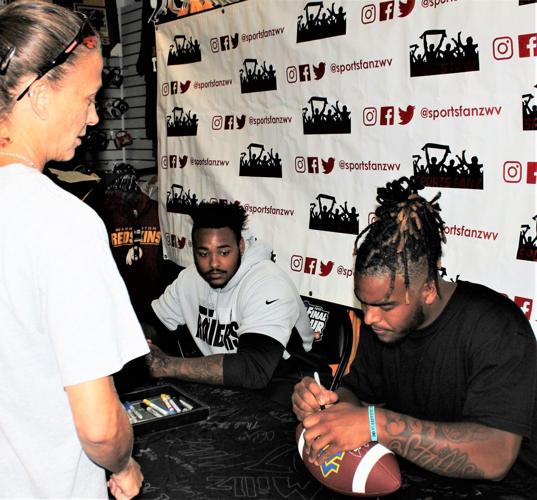 WVU football stars sign autographs at Sports Fanz Putnam News