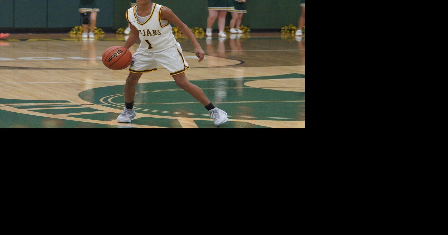 Trojans hold off Harris in double overtime