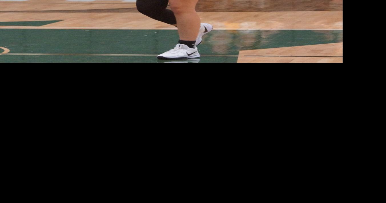 Lady Trojans drop road contest to Harris