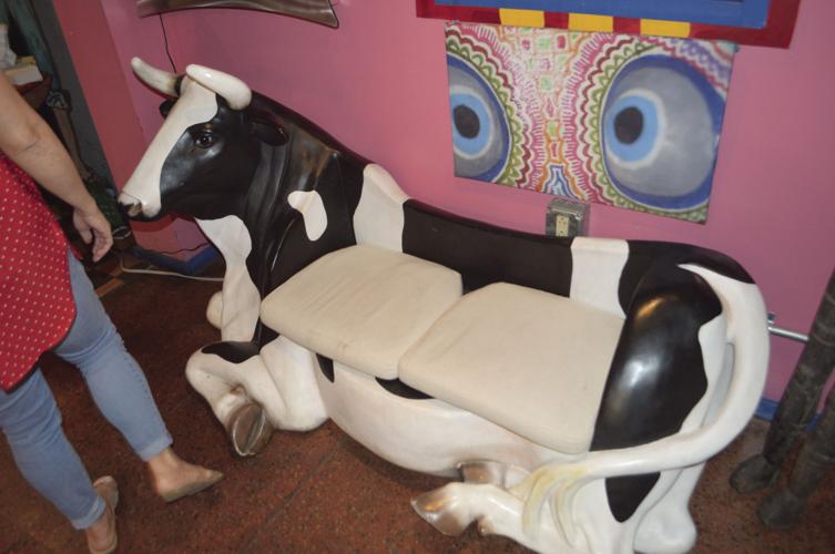 CUZ18 - The dining room sports a cow-couch.