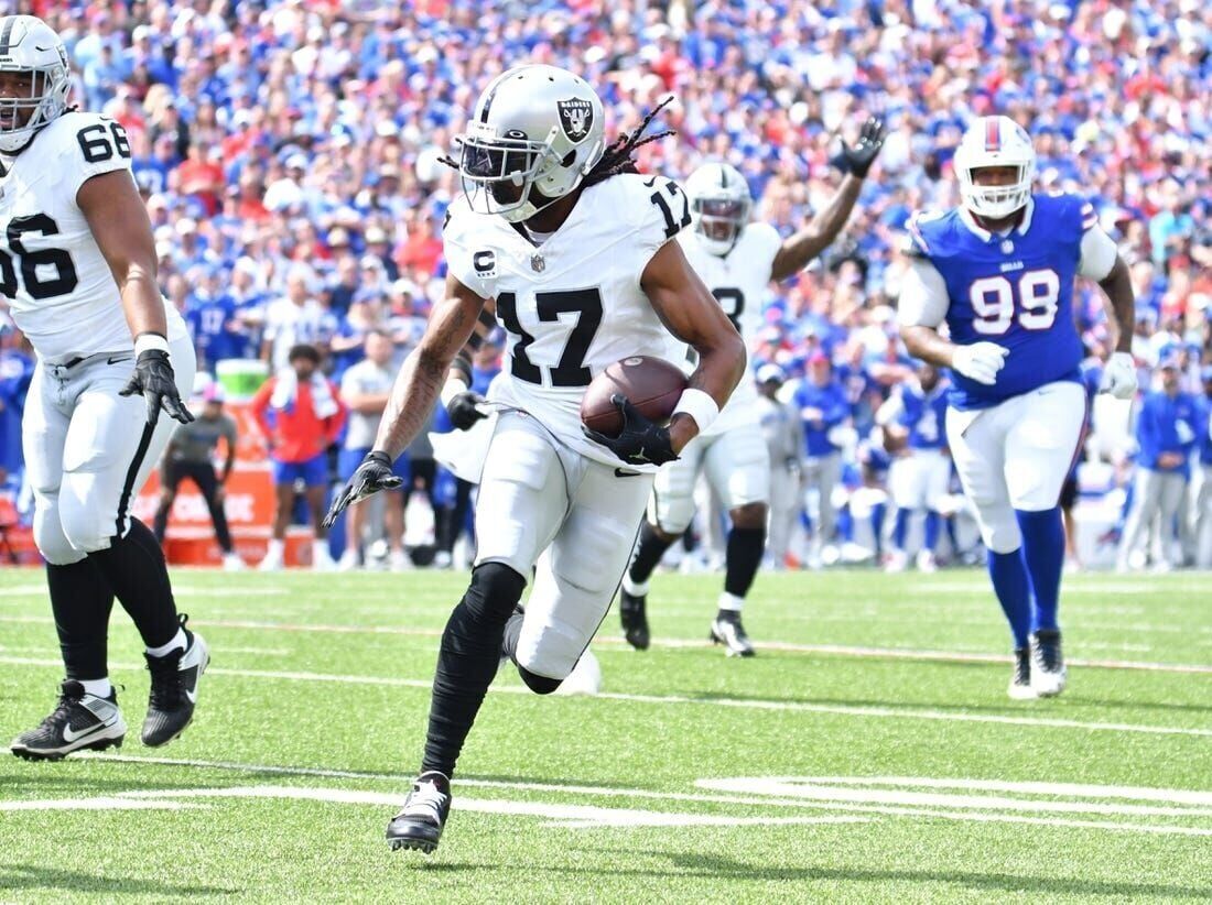 Las Vegas Raiders wide receiver Davante Adams (17) runs for a touchdown  during the first half of an NFL football game against the Buffalo Bills,  Sunday, Sept. 17, 2023, in Orchard Park