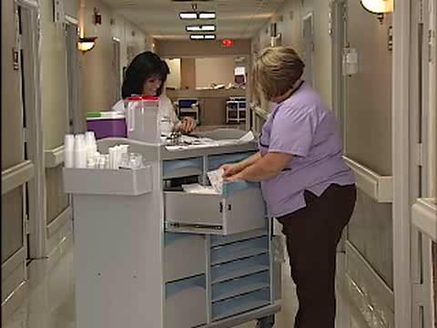 Image result for nurse with medication cart pic