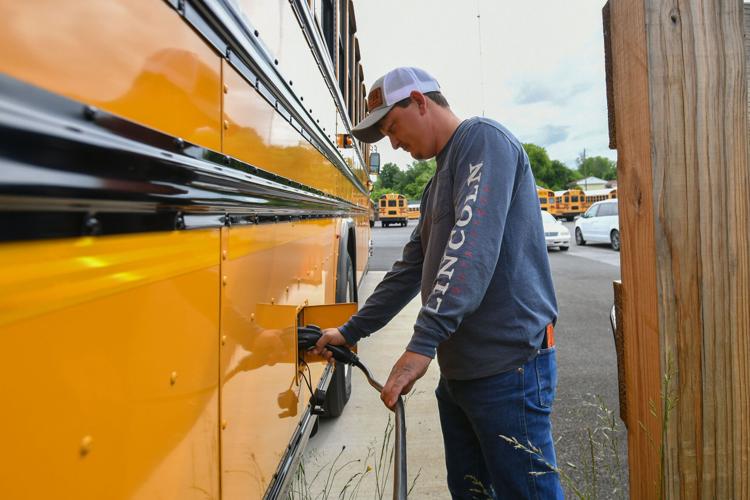 Some area school systems add electric buses to fleets