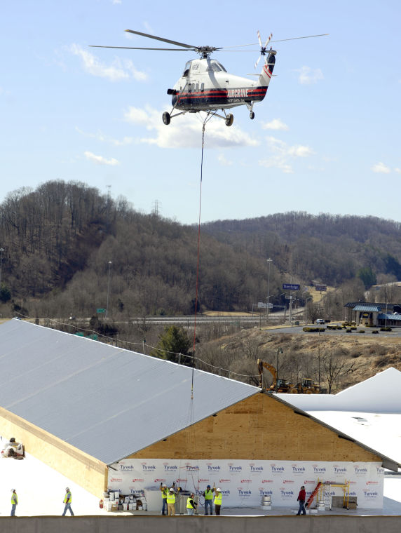 Helicopter brought in to install HVAC units on Bass Pro Shops roof