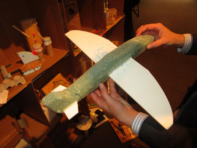 Andy Marquart holds an airplane fashioned by a visitor at the "Make It. Take It." exhibit.