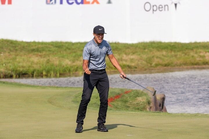 Cameron Champ celebrated after making his final putt at the 18th hole to win the 3 M Open at TPC Twin Cities in Blaine on Sunday.