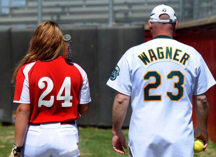 Denny Wagner supports his daughter Haley in softball
