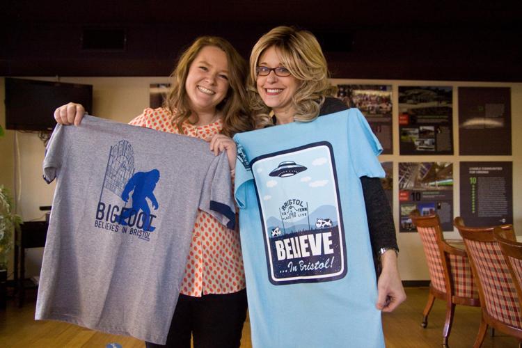Bigfoot, anyone? Believe in Bristol's associate director Maggie Bishop and executive director Christina Blevins model their popular Bigfoot Believe in Bristol and alien t-shirts.