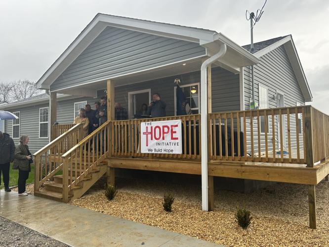 Mayfield comes together for memorial walk, home dedications two years