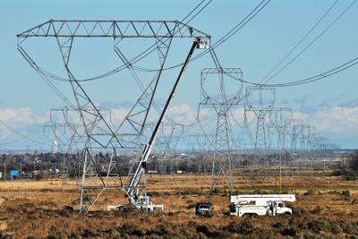 Controversial power line crosses milestone