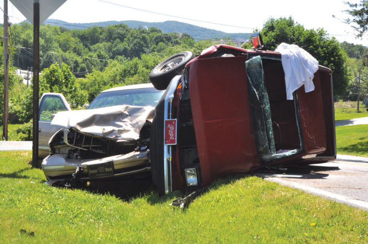 UPDATED Truck flips, driver escapes injury
