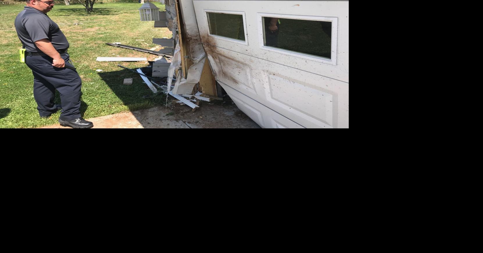 Car crashes into home; one person taken to hospital