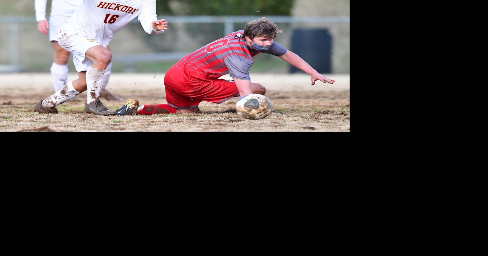 Soccer Hickory slides by St. Stephens on muddy field to remain