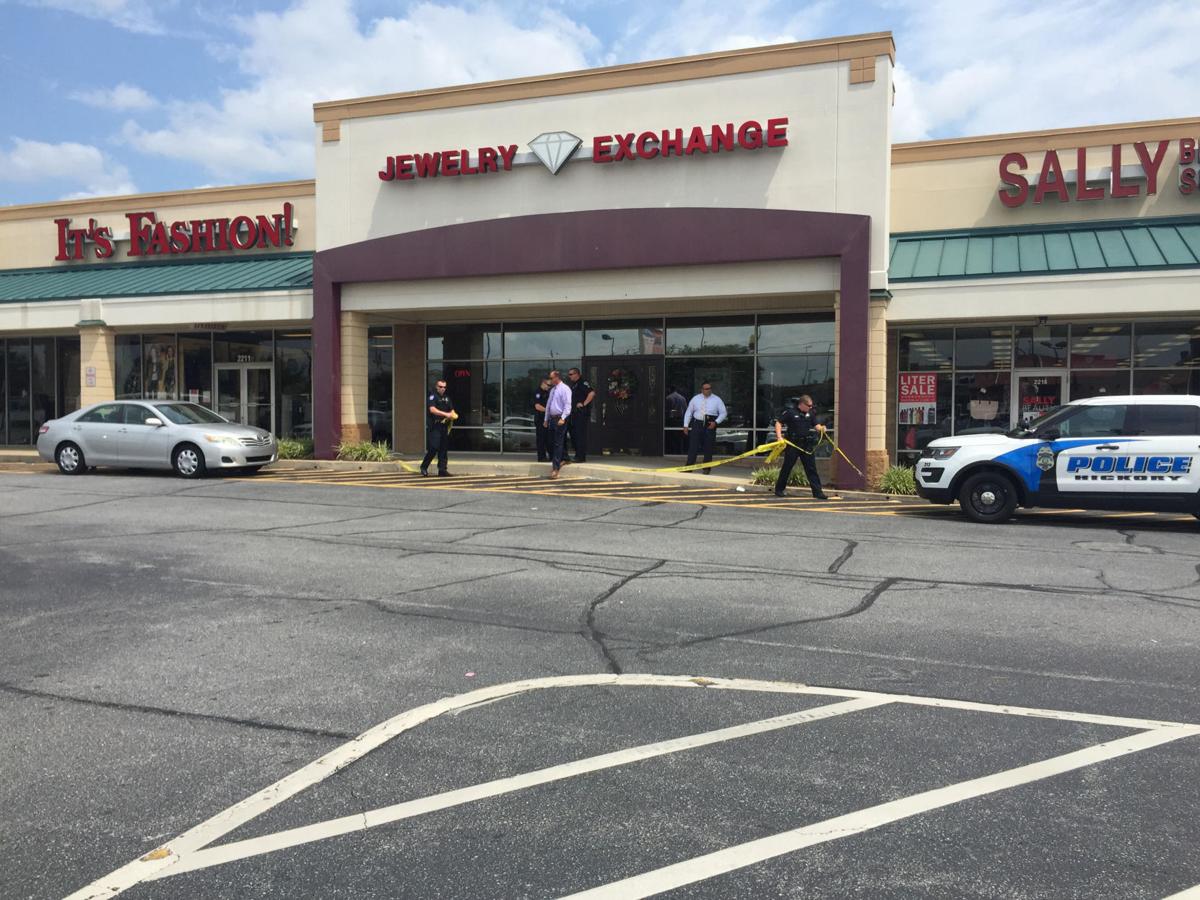 Two armed men rob Jewelry Exchange, flee on motorcycle